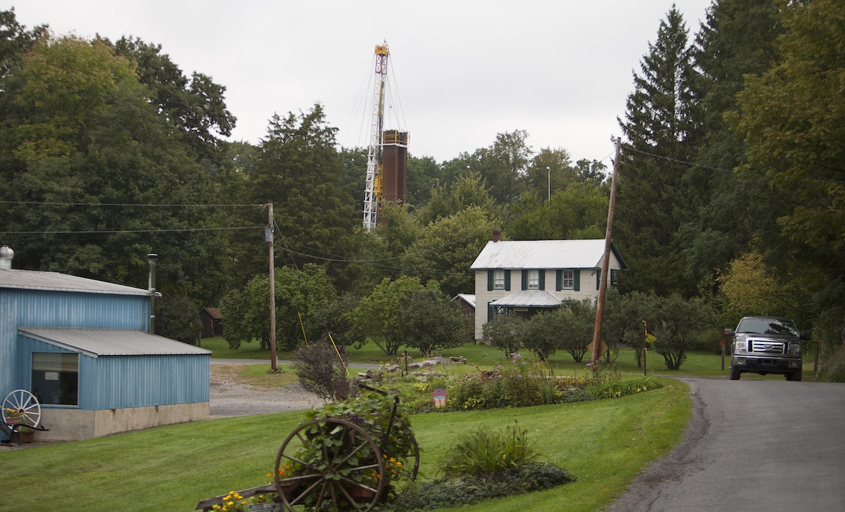 A home near a rig for drilling and fracking for natural gas near Calvert, Pennsylvania
