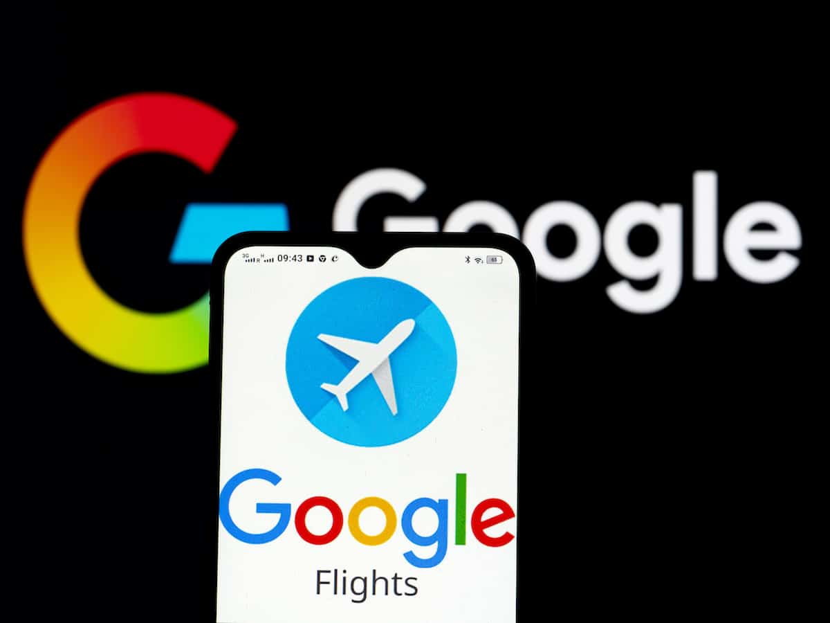 A Google Flights logo displayed on a smartphone