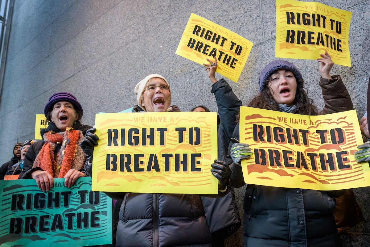 Protestors with "Right to Breathe" signs demonstrate against the auction of a South Philadelphia oil refinery