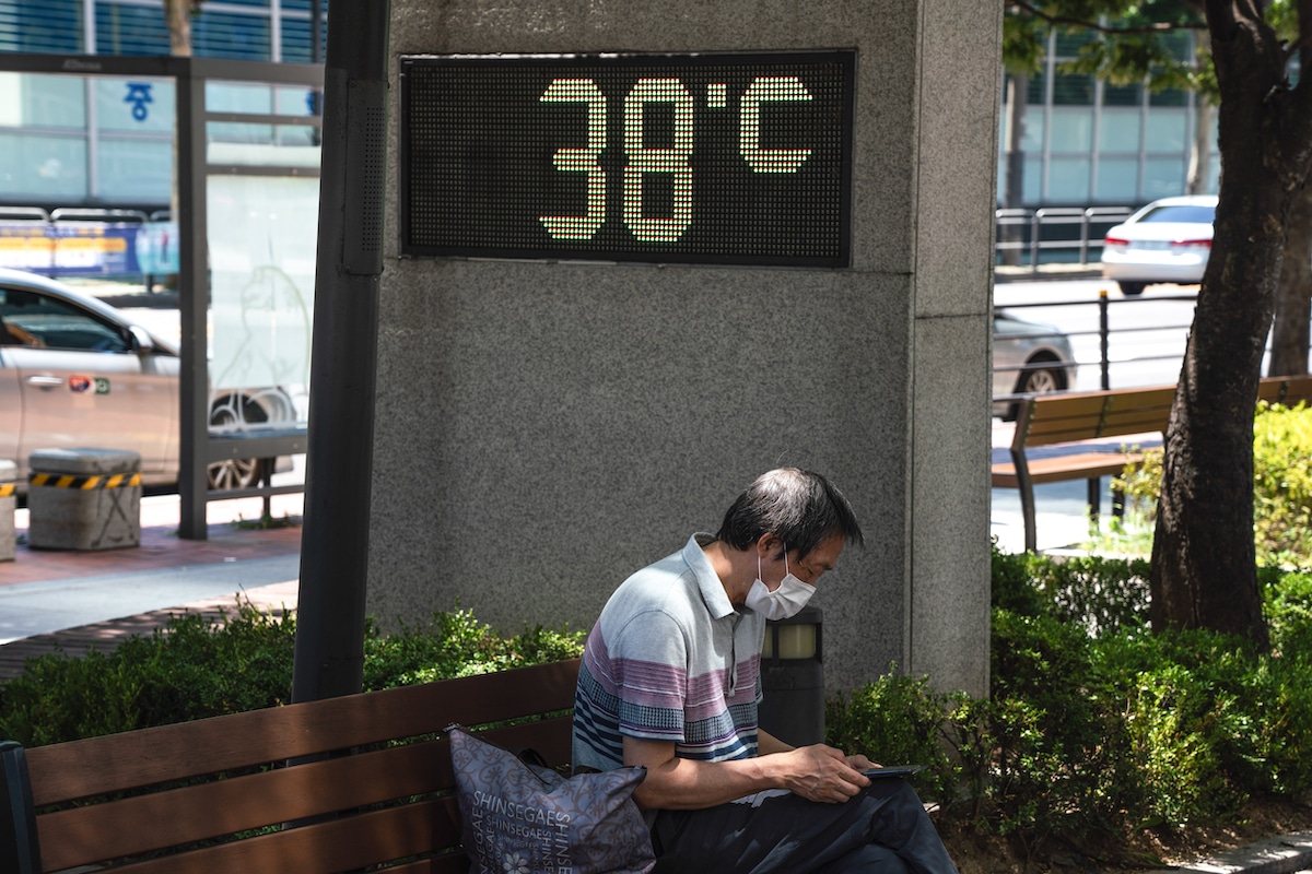 A thermometer on the street reads 38°C (100°F) during a heat wave in Seoul, South Korea