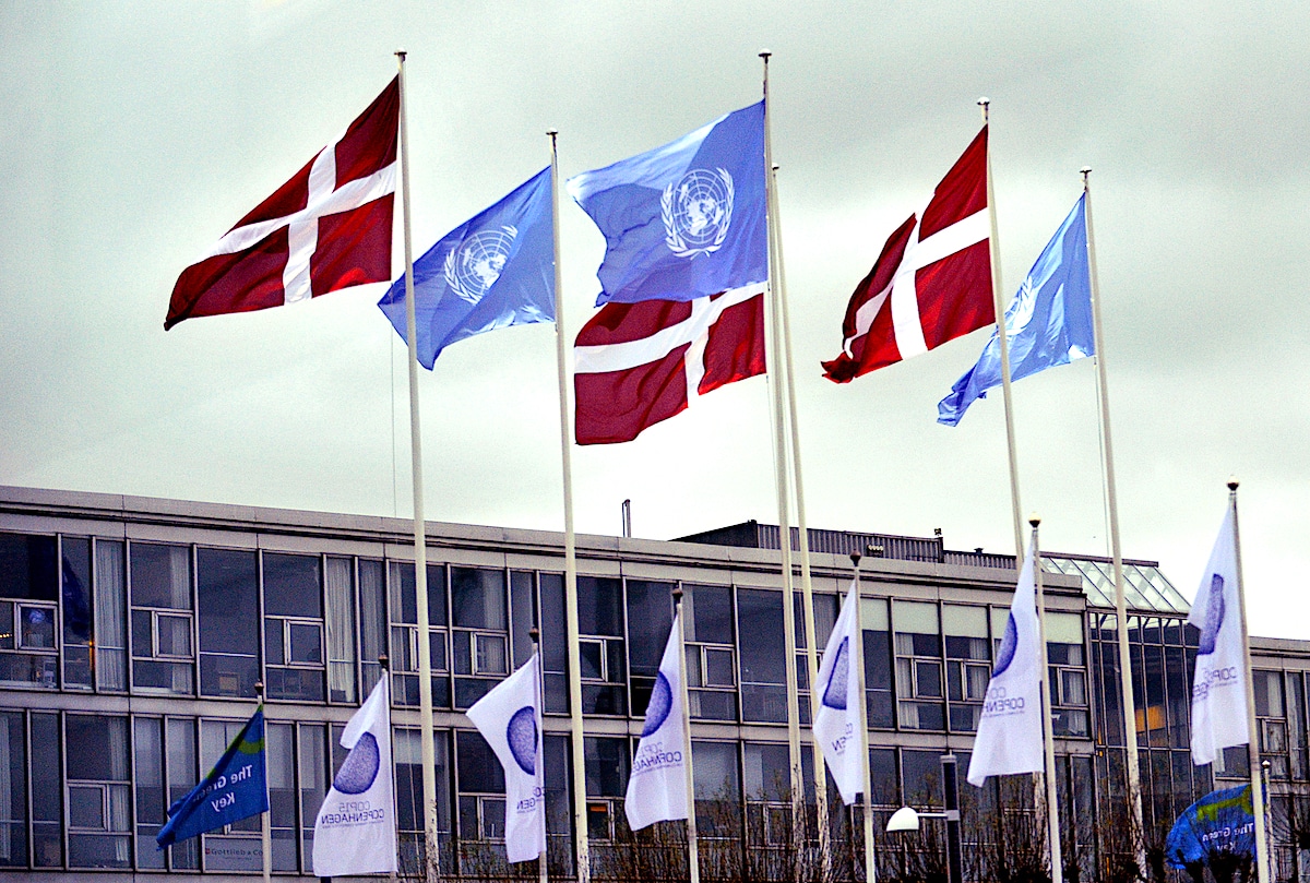 United Nations and Danish national flags together with the flag of the UN Climate Change Conference (COP15) in Copenhagen, Denmark in 2009