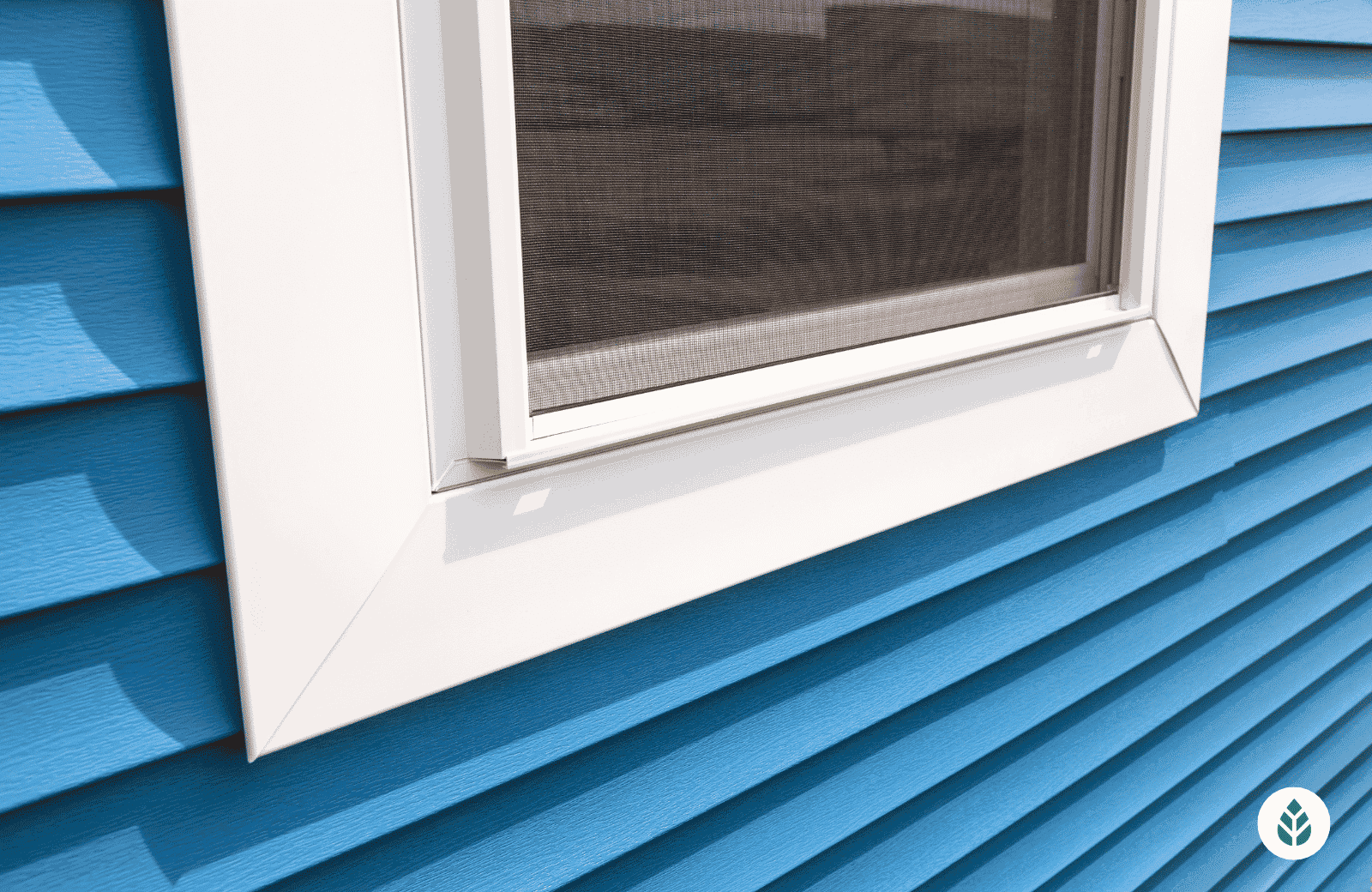 vinyl window on blue home 