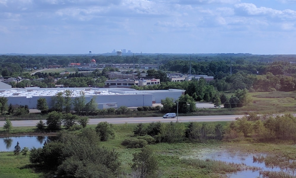Aerial view of Blane, MN, with Minneapolis skyline in the distance