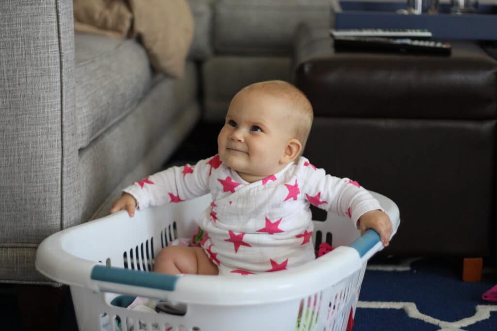 baby in a laundry basket