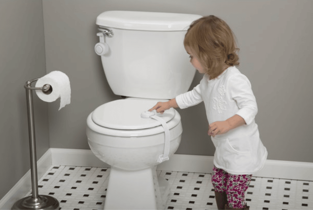 toddler pointing at locked toilet seat