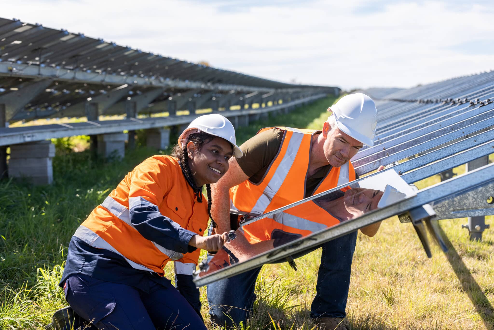 Solar technicians install a solar array
