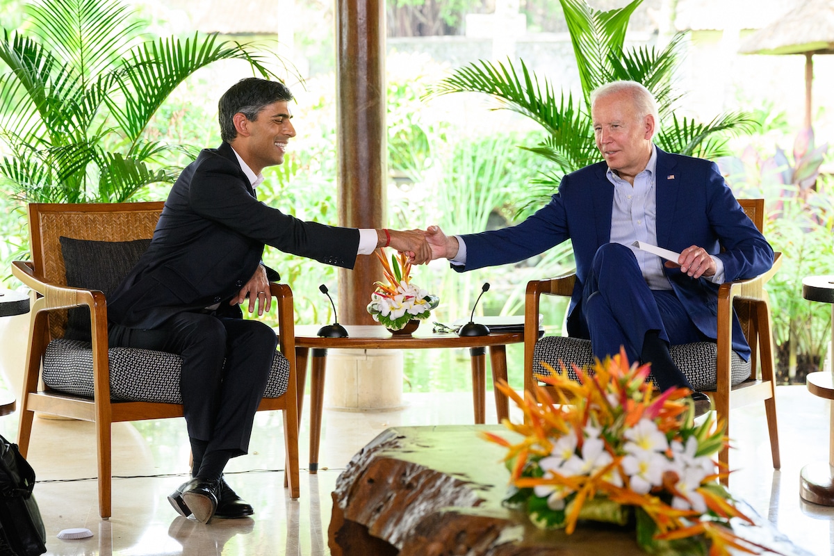British Prime Minister Rishi Sunak shakes hands with U.S. President Joe Biden during the G20 summit in Indonesia