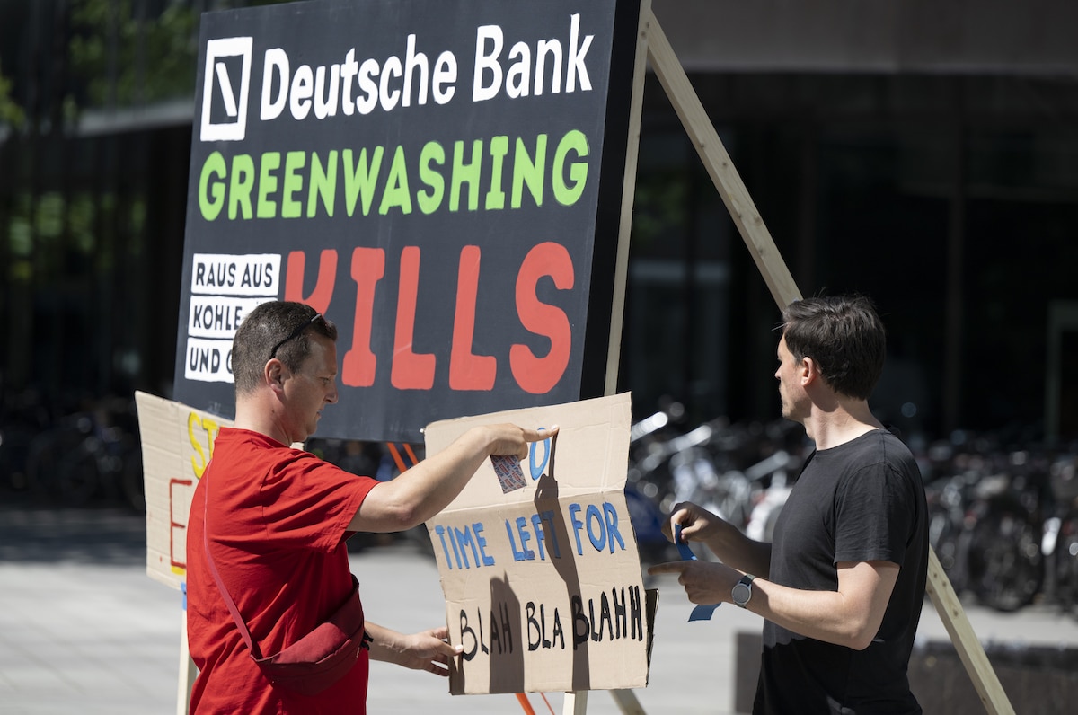 Climate activists protest against greenwashing in front of Deutsche Bank