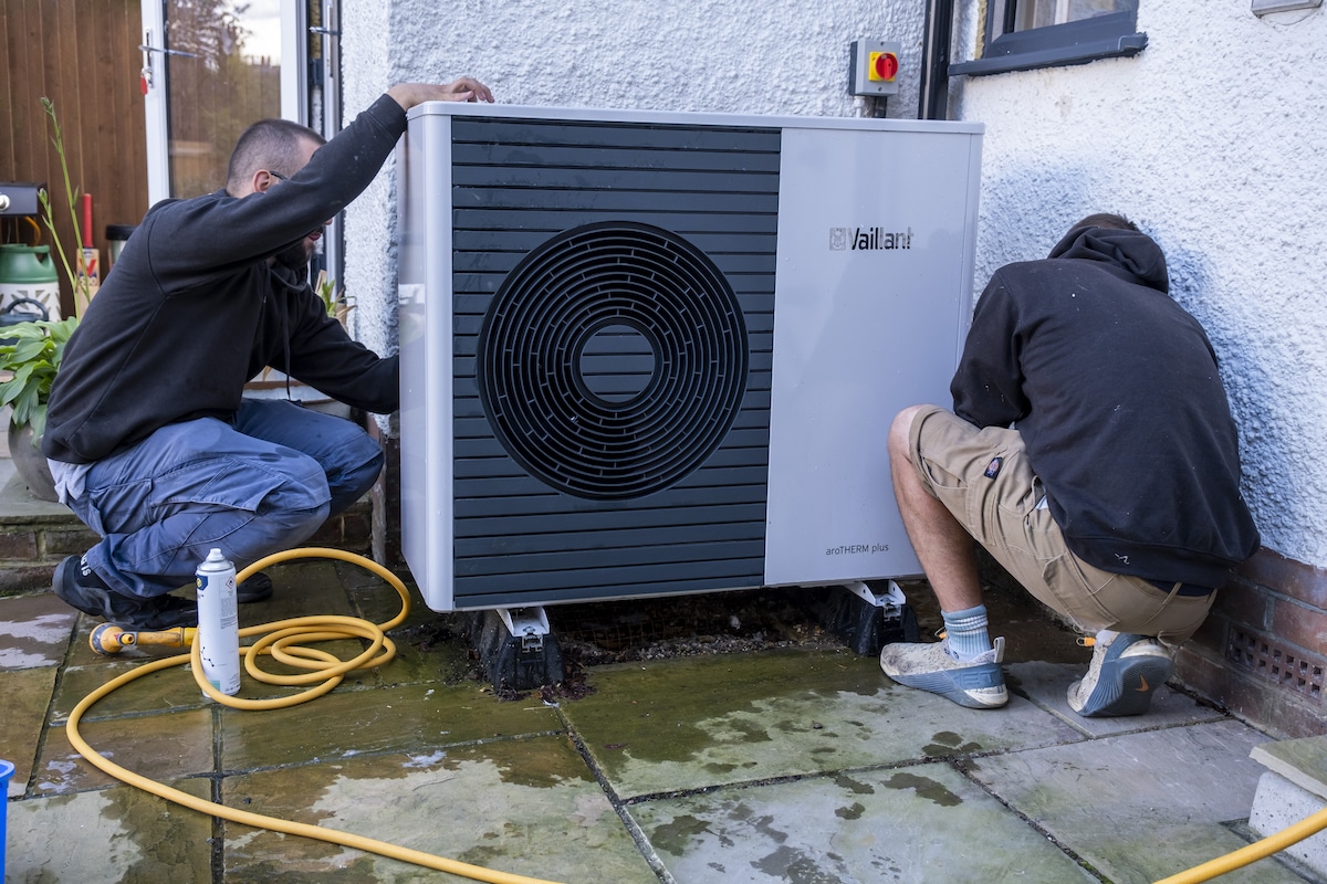 Technicians service a heat pump on a house in Folkestone, UK
