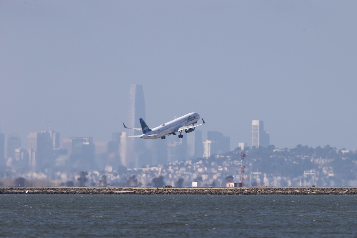 A JetBlue plane takes off at San Francisco International Airport