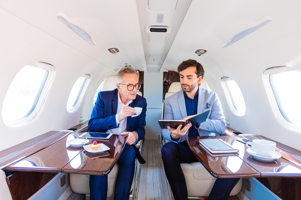 Businessmen on thier private plane in the UK