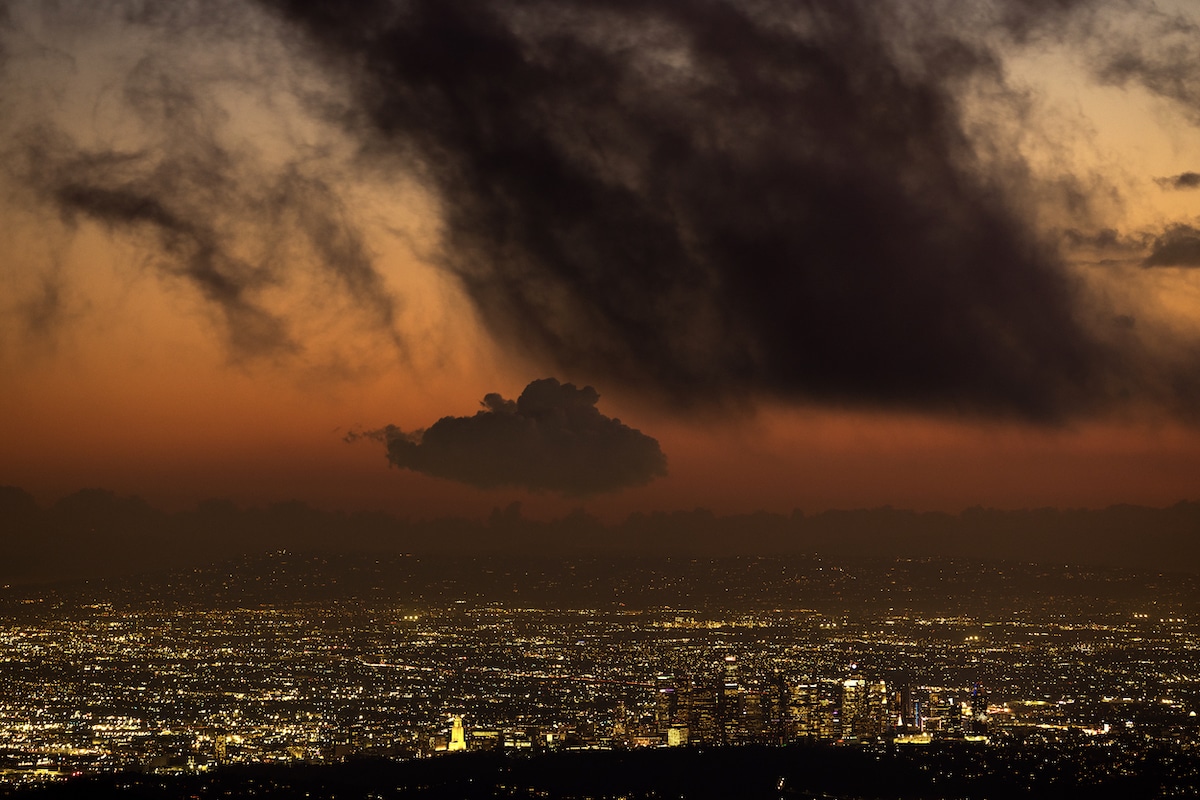 Storm clouds over downtown Los Angeles as a massive storm leaves California to spread across the nation