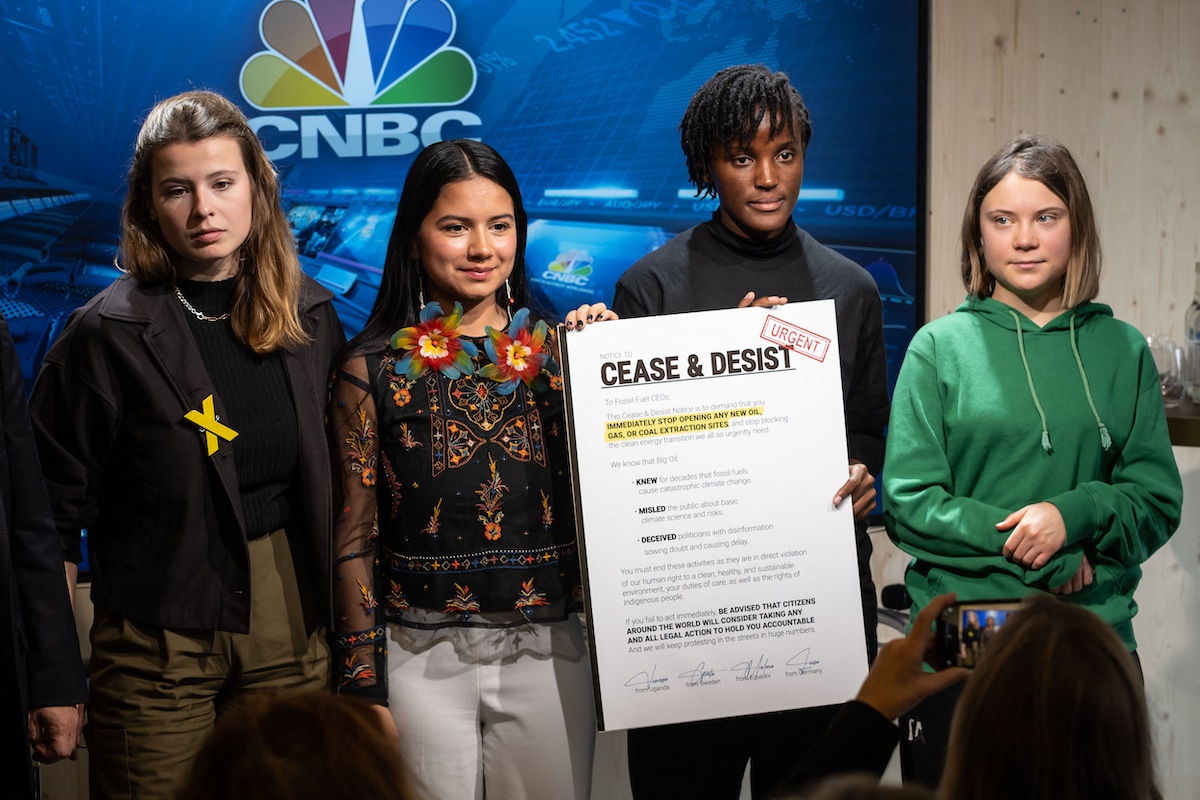 Young climate activists attend the World Economic Forum with their cease and desist letter to fossil fuel executives