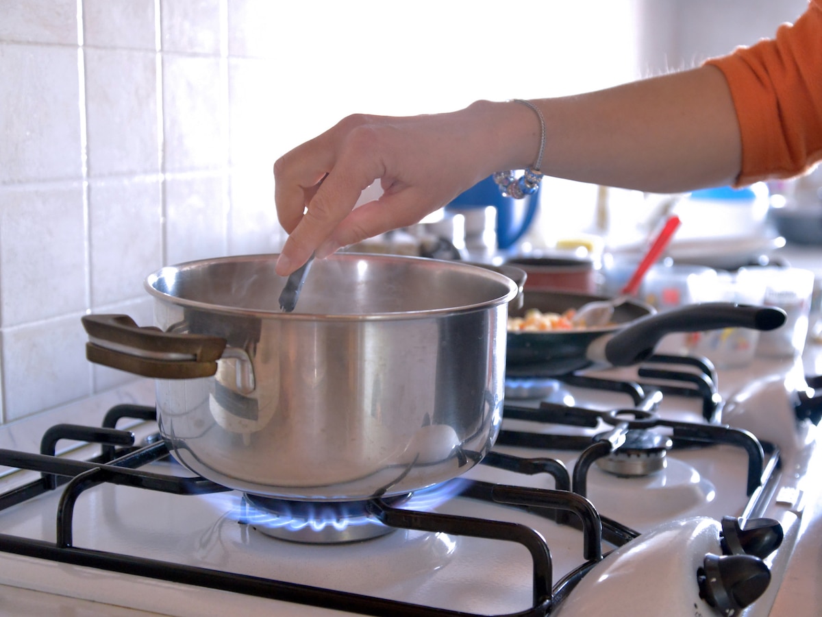 A pot cooking on a gas stove