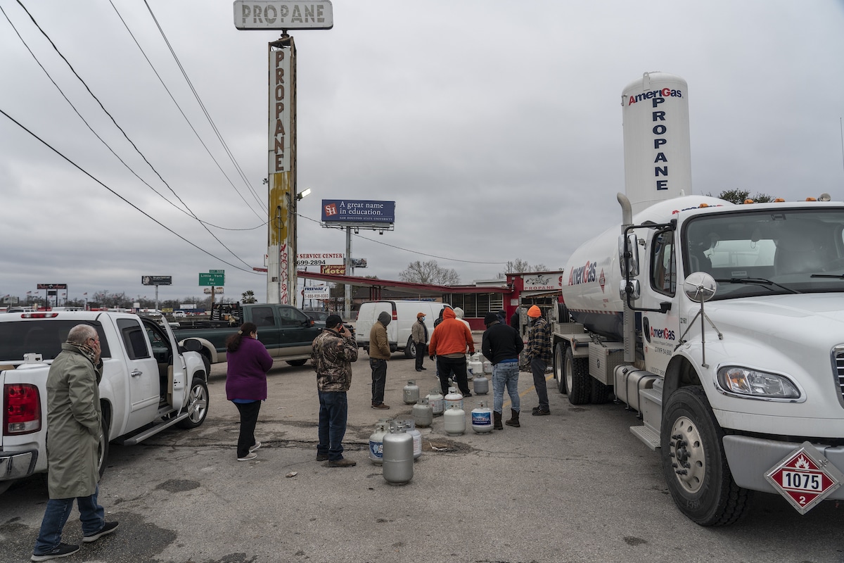 People line up at a propane gas station to refill their tanks after winter weather caused electricity blackouts in Houston, Texas