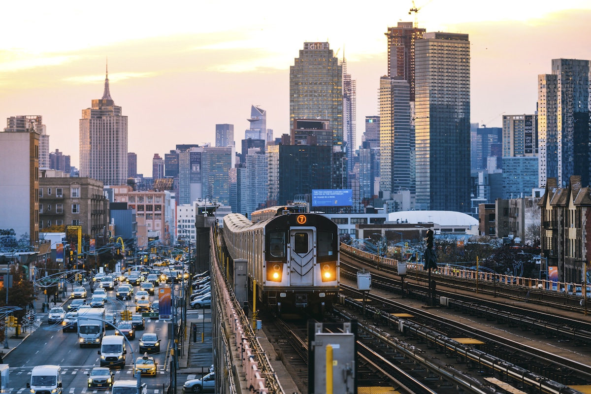 A subway train in Queens with Manhattan skyline, New York City