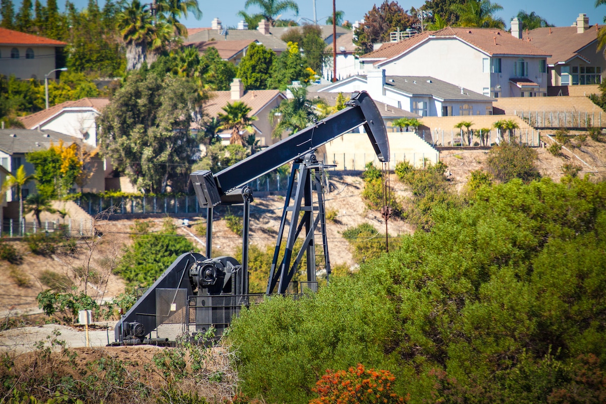 An oil pumpjack near homes in the Inglewood Oil Field, Los Angeles, California