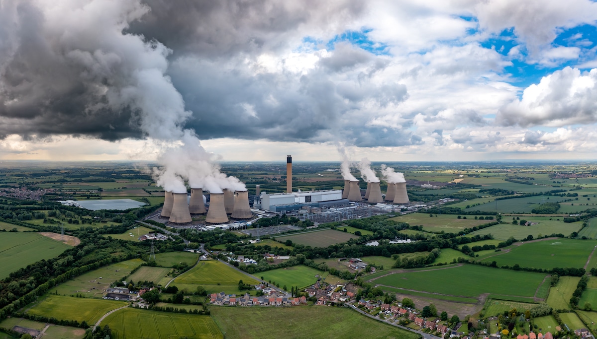 An aerial landscape view of the Drax Power Station in North Yorkshire, UK emitting carbon dioxide pollution into the atmosphere
