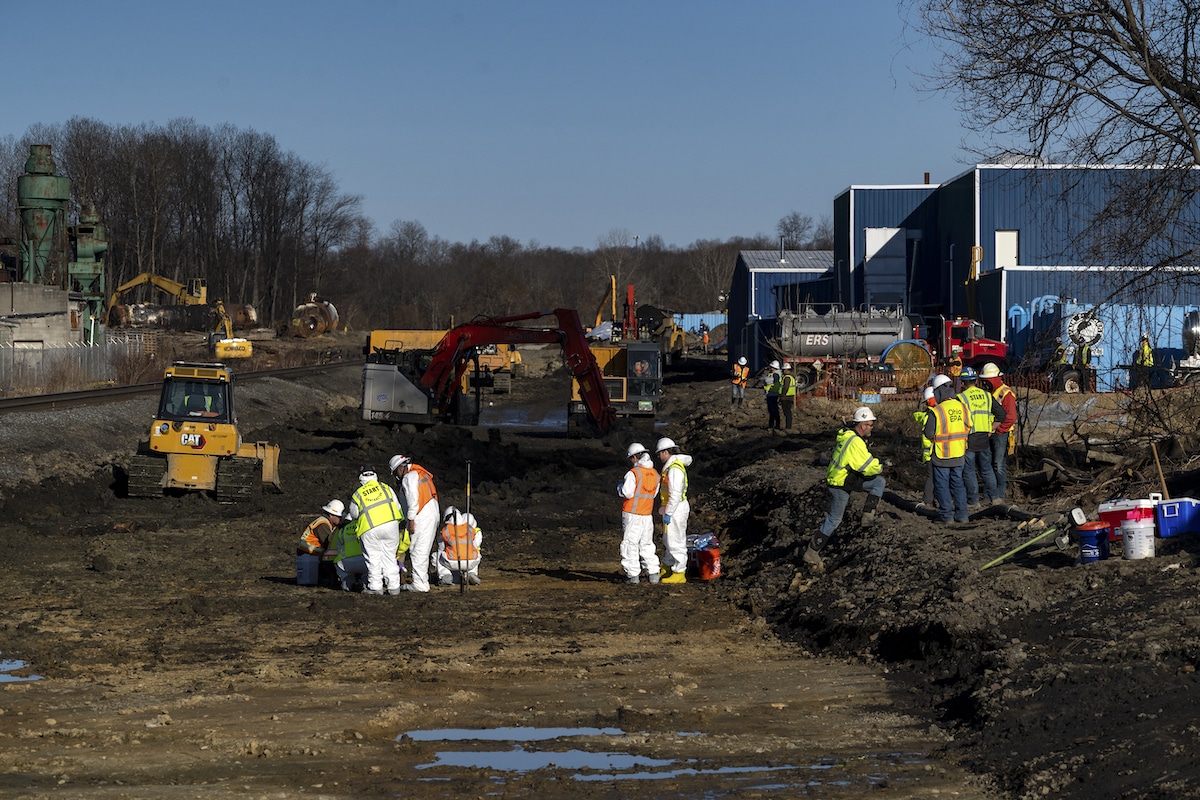 Ohio EPA and federal EPA contractors collect soil and air samples from the Norfolk Southern train derailment site in East Palestine, Ohio