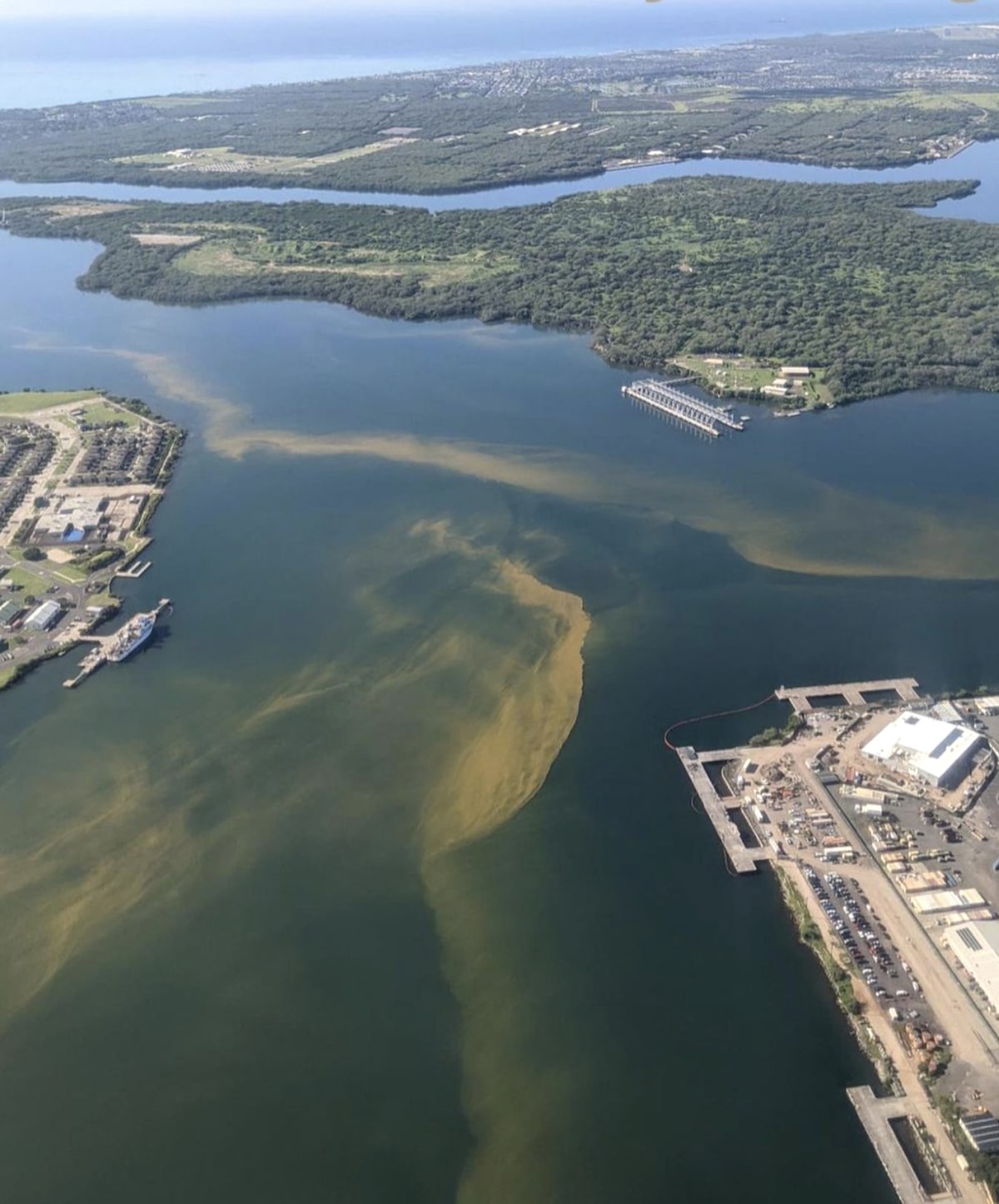 A photograph shows still-contaminated water in Pu'uloa (Pearl Harbor) in January 2022 after the U.S. Navy flushed millions of gallons of water out to sea after first pumping the fuel-contaminated water through treatment filters in affected homes and neighborhoods