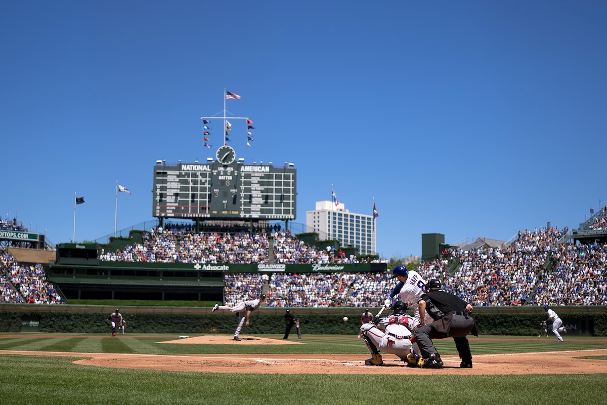 A batter hits a pitch at Chicago's Wrigley Field, which could see the largest uptick in home runs as the climate warms
