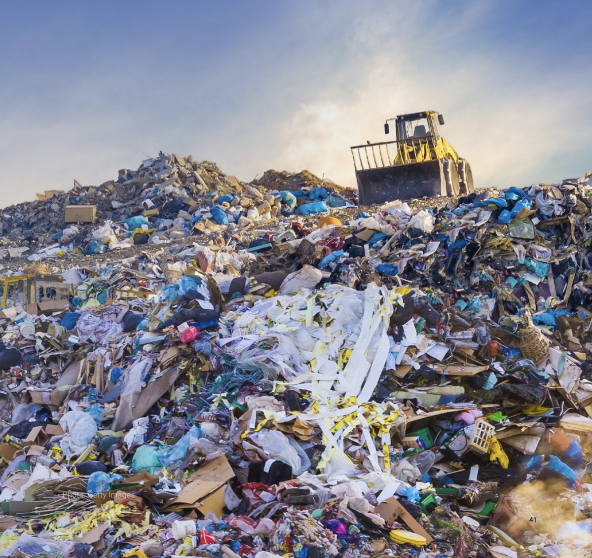 A new United Nations Environment Programme report focuses on reducing plastic pollution, illustrated here by a dump truck in a large landfill mound of plastic waste.