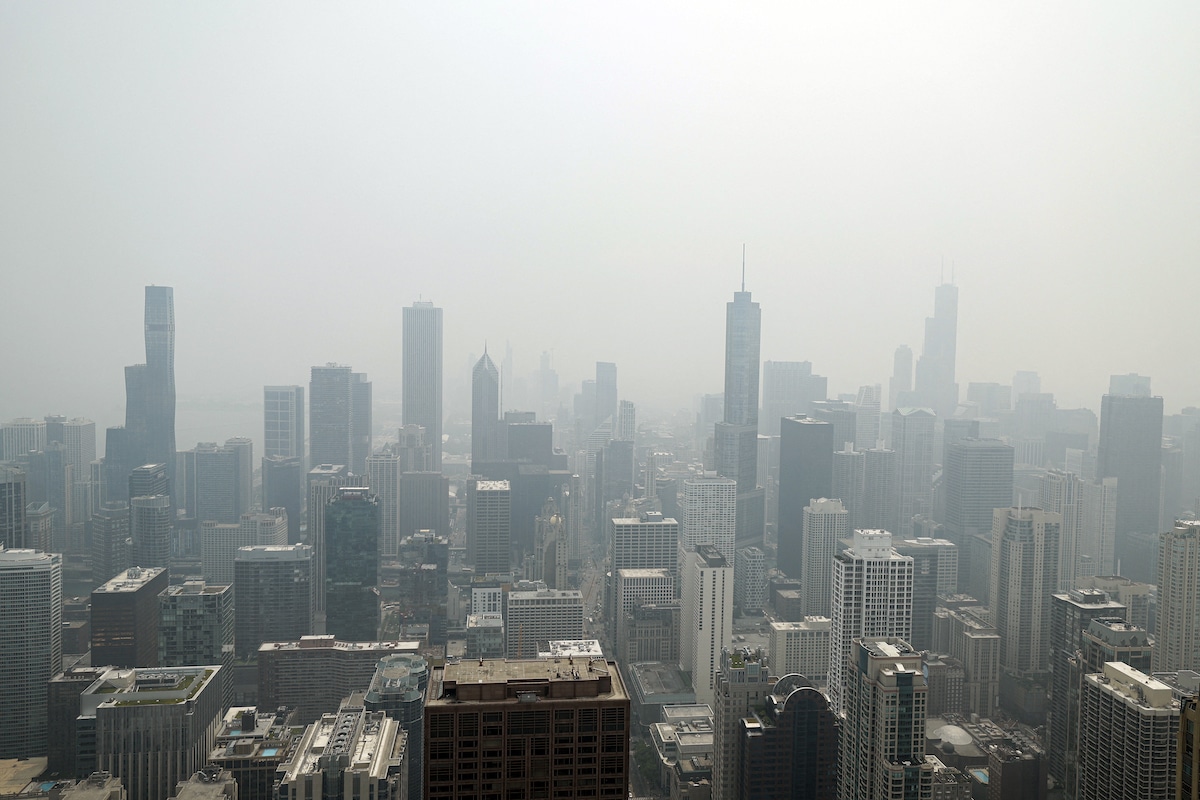 Chicago's skyline with heavy smoke from Canada’s wildfires, seen from the 360 Chicago Observation Deck of the John Hancock Building