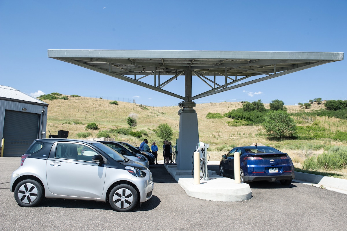 Electric cars at a charging station during a legislative staff tour of the National Renewable Energy Lab in Golden, Colorado