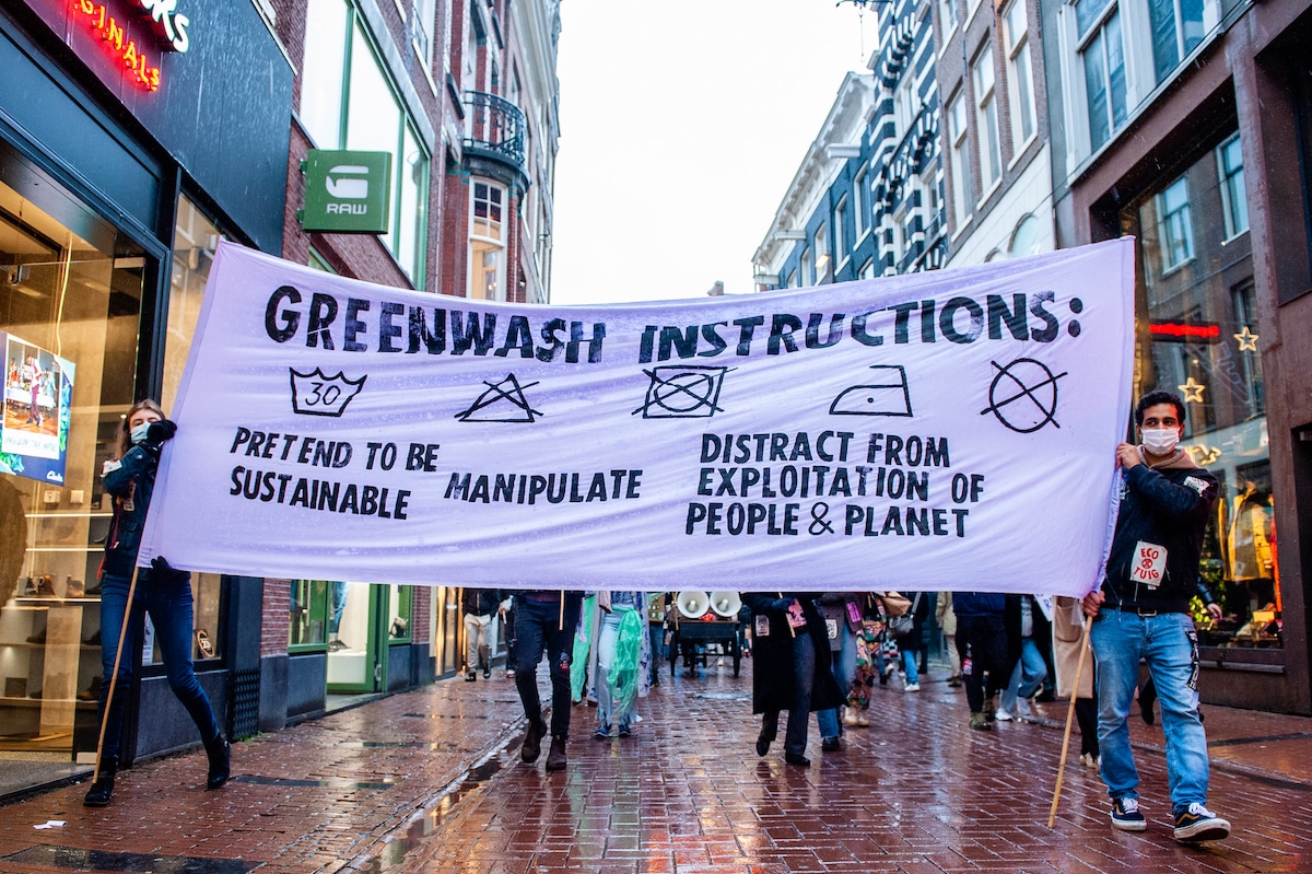 Environmental activists demonstrate against greenwashing in Amsterdam