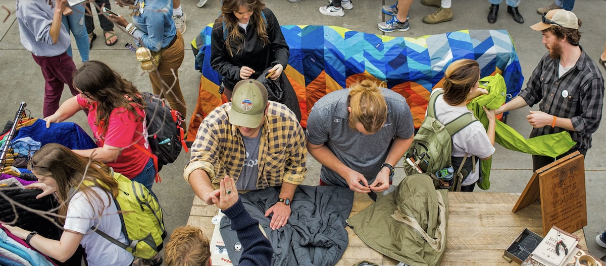 Customers shop for used clothes and gear at a Patagonia Worn Wear mobile outdoor event in Athens, Georgia