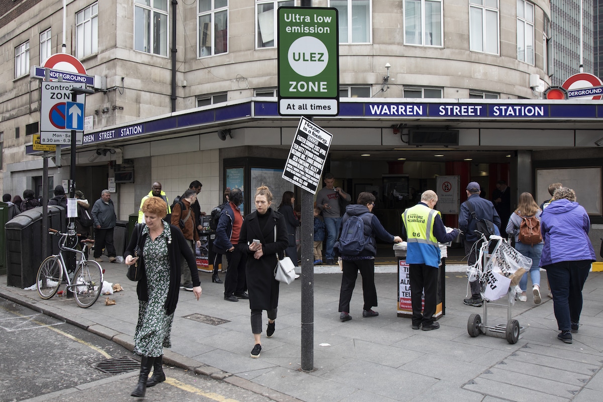 Pedestrians stroll in an Ultra Low Emission Zone (ULEZ) by the Warren Street Underground station in London, UK