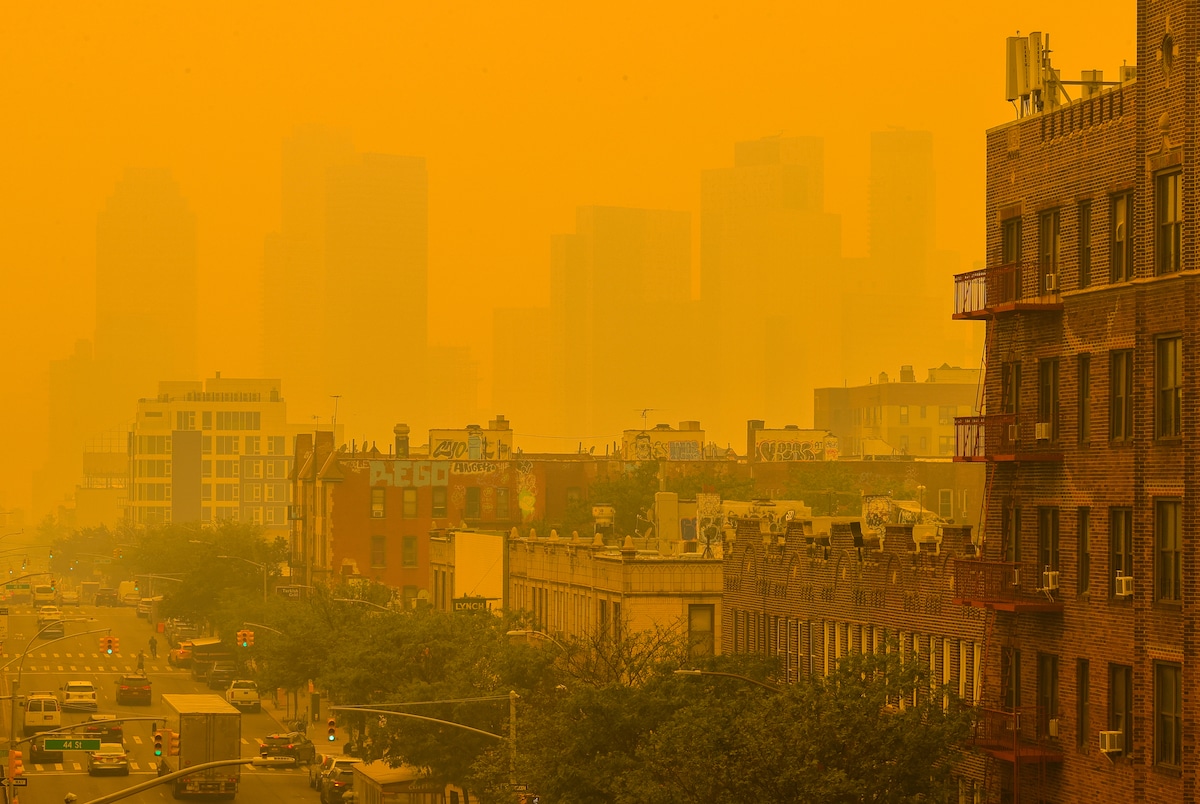 Smoke from Canada’s wildfires makes an orange haze over New York City