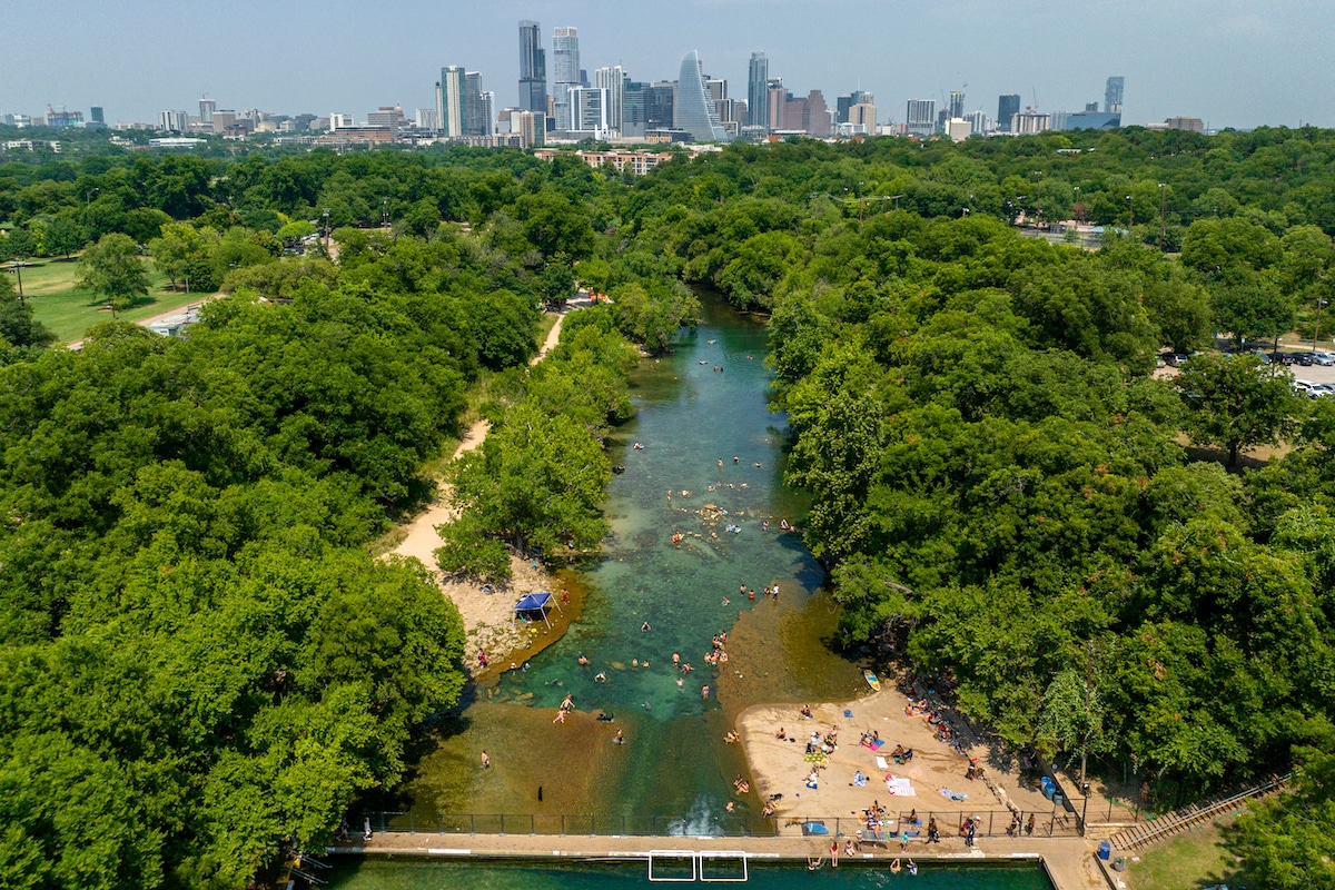 People gather at Barton Springs Pool in Austin, Texas during extreme heat in June