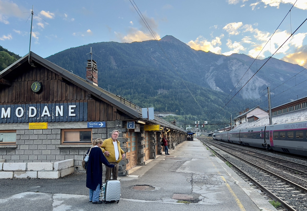 Passengers wait for the high speed train to Milan, Italy from the Modane station in the French Alps