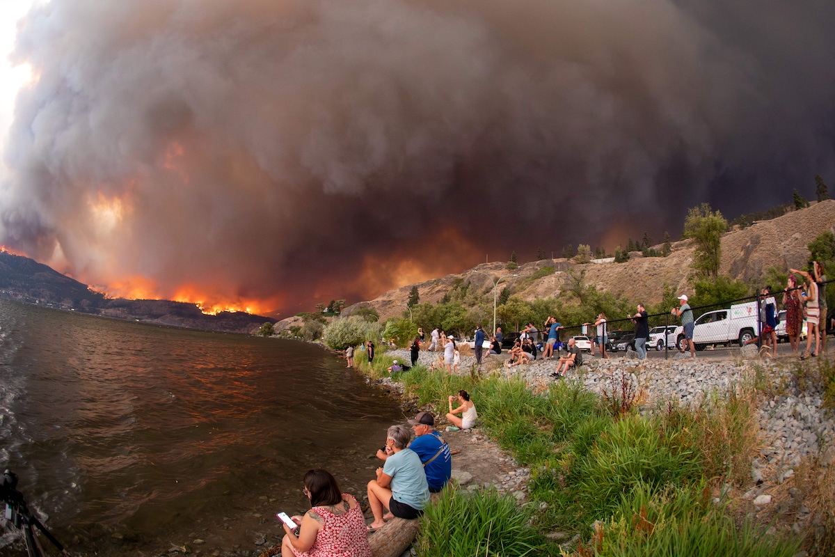 Residents watch the McDougall Creek wildfire in West Kelowna, British Columbia, Canada