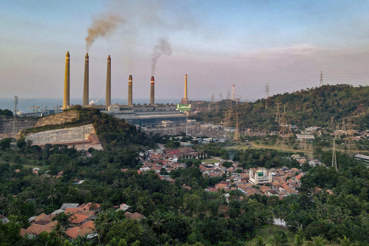 Village houses near the massive Suralaya coal power plant in Cilegon, Indonesia