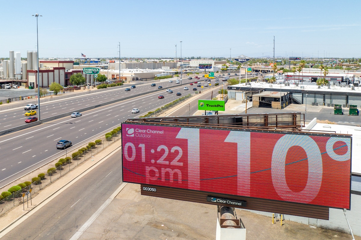 A roadside billboard displays the temperature of 110°F that would reach 115°F in Phoenix, Arizona