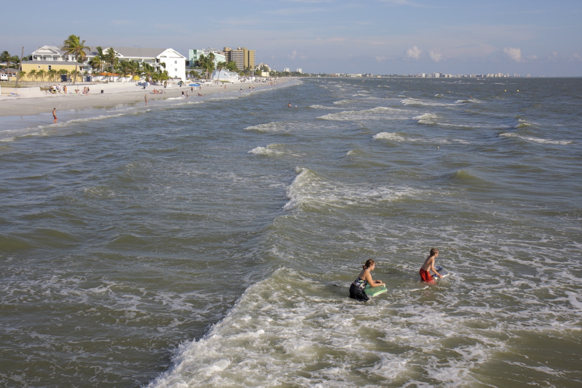 People enjoying the water at Ft. Myers Beach in Florida