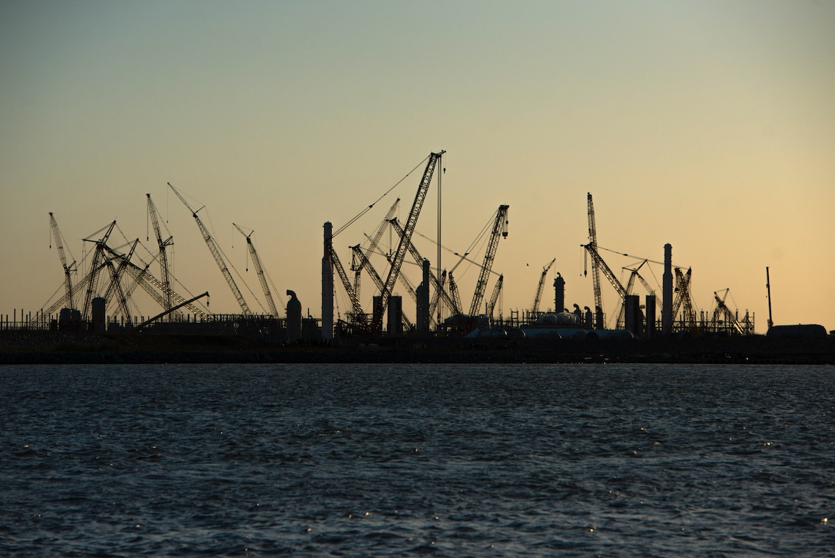 Construction cranes at the Golden Pass LNG Terminal in Sabine Pass, Texas in 2022