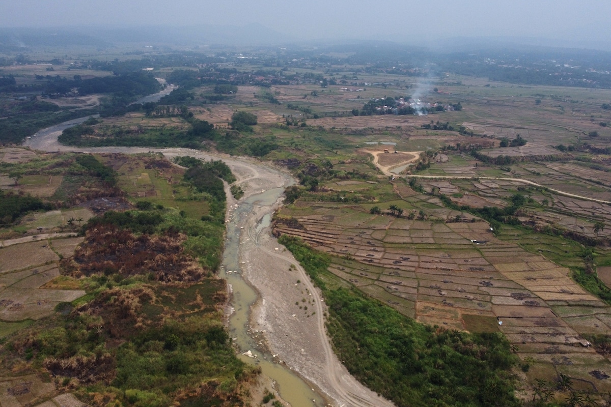 Aerial view showing how extreme drought in Indonesia due to El Niño has impacted deforested farm land on the banks of the Cipamingkis River