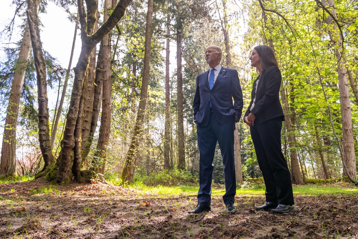 President Joe Biden records a video with University of Washington forest ecologist Susan Prichard at Seward Park in Seattle