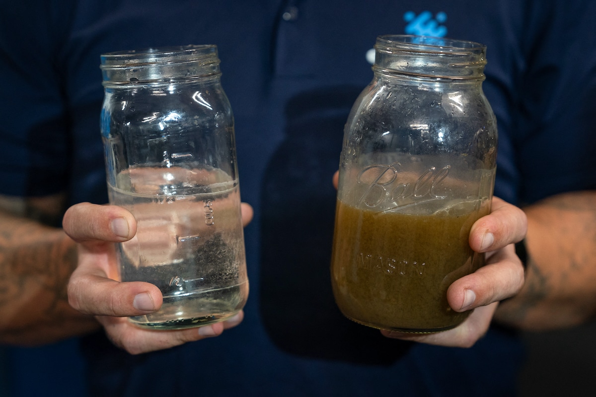 Recycled wastewater from a San Francisco skyscraper, treated by startup company Epic Cleantec, held next to a sample of untreated wastewater