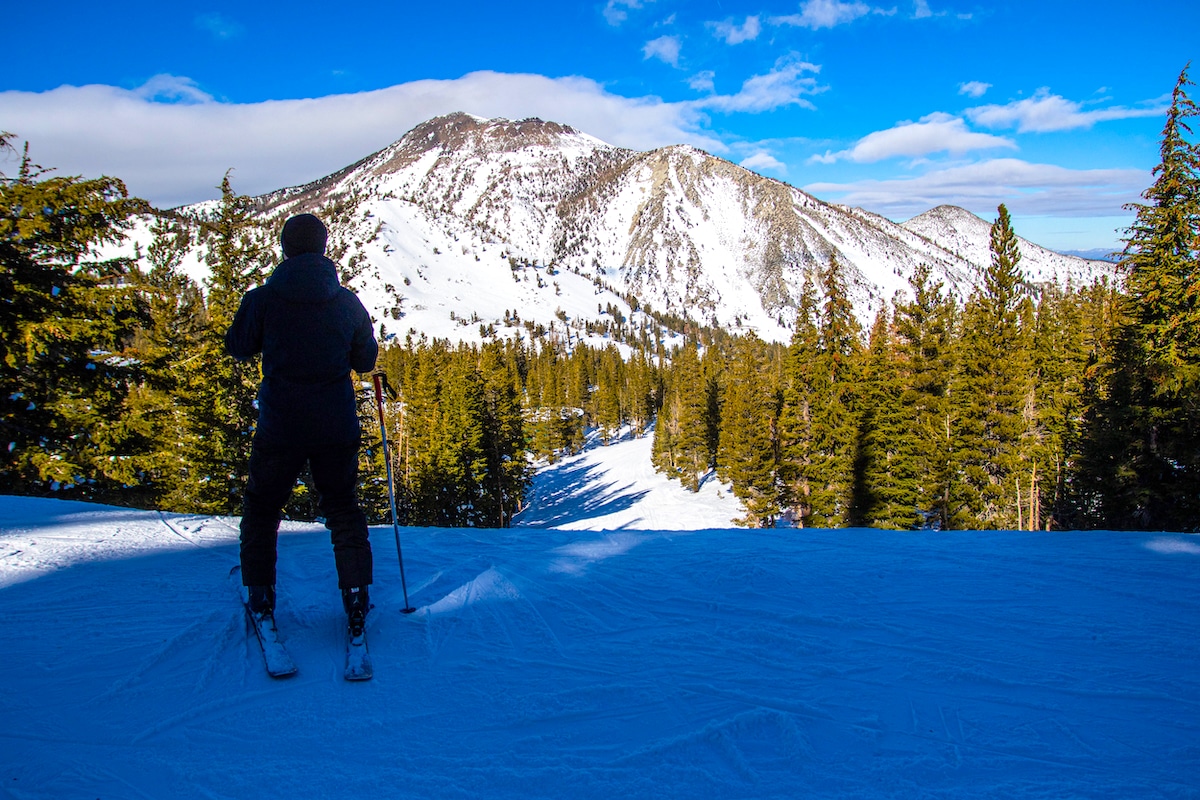 A skier pauses by a Natural Resources Conservation Service snowpack testing area in Incline Village, Nevada