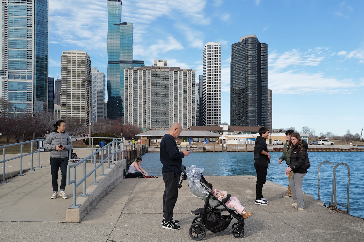 People visit the lakefront as temperatures climbed to near 60°F, more than 20 degrees above normal in Chicago, Illinois
