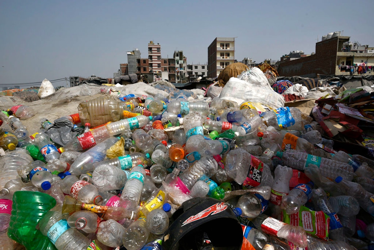 Plastic bottles and containers at a garbage dump on the banks of the Yamuna River near Okhla in New Delhi, India