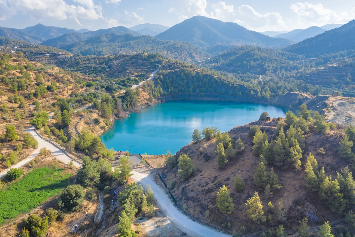 The site of a former copper mine in Xyliatos, Cyprus, restored by creating a lake and reforesting the surrounding environment
