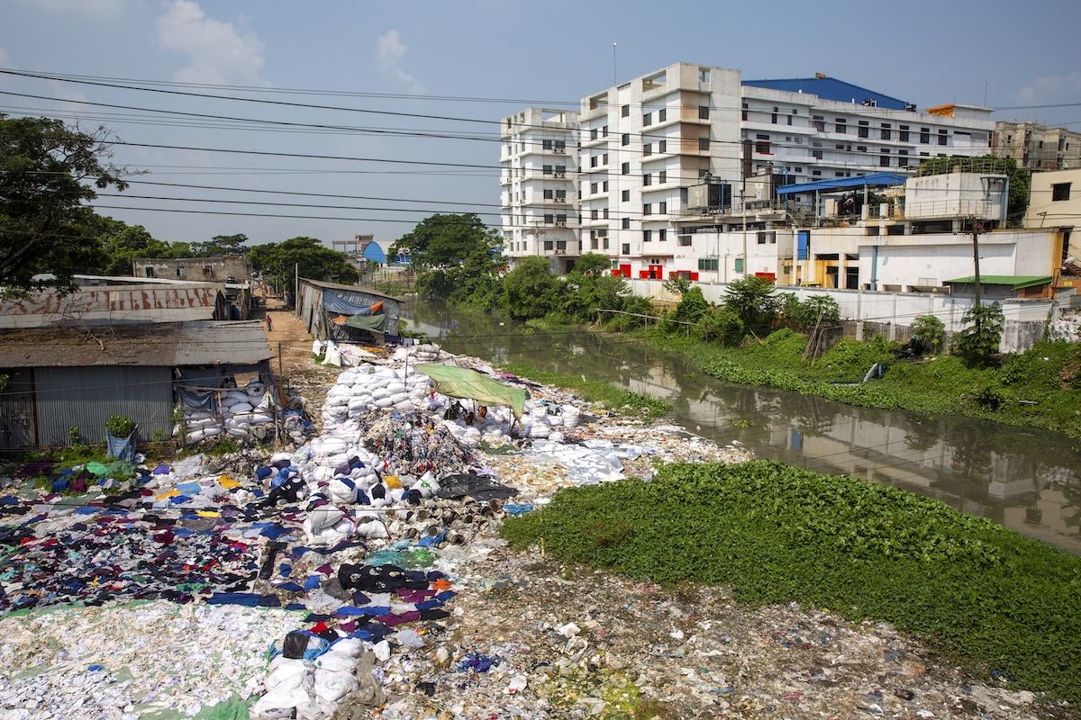 Environmental pollution on the river banks surrounding textile industry buildings in Dhaka, Bangladesh