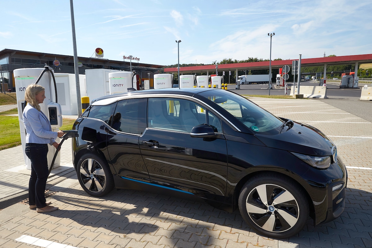 A driver charges her electric car at Germany's first ultra-fast EV charging station at the Brohltal Ost service station near the A61 motorway in 2018