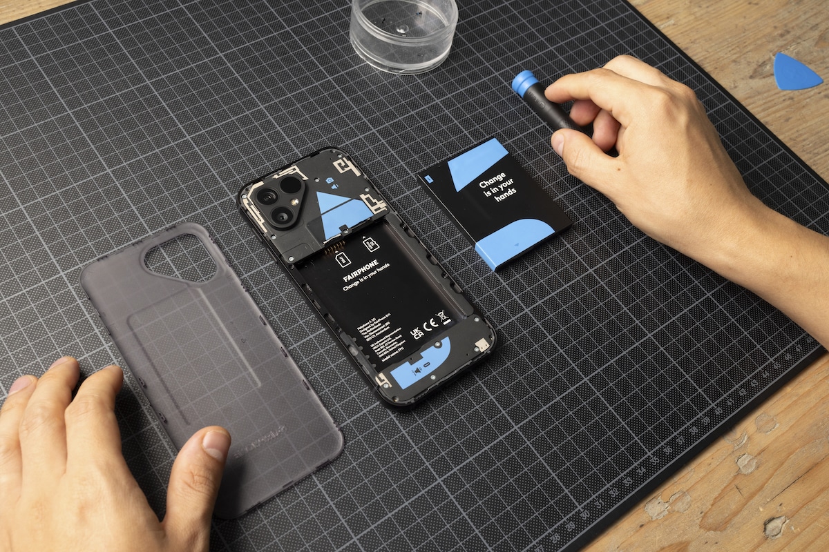 A cellphone owner takes apart a Fairphone 5, advertised as the world’s first customer-repairable mobile phone, in Amsterdam, the Netherlands