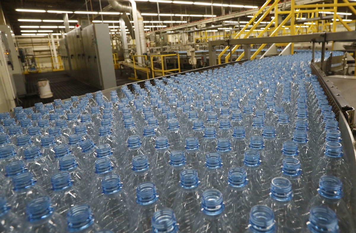Empty plastic bottles move down a production line to be turned into Dasani bottled water at a Coco-Cola bottling plant in Salt Lake City, Utah